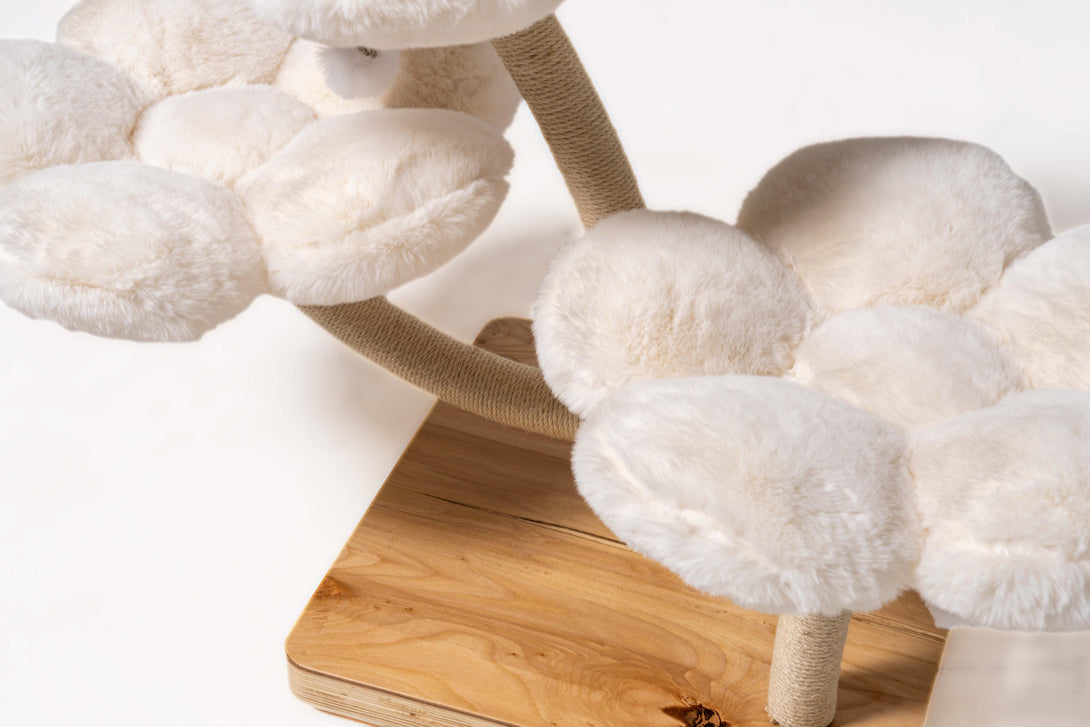 Cats relaxing comfortably on the inviting Ivory Blossom Cat Tree
