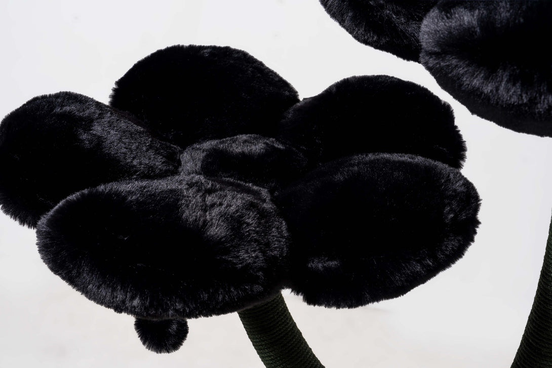 Large cats lounging comfortably on the luxurious cat bed cave