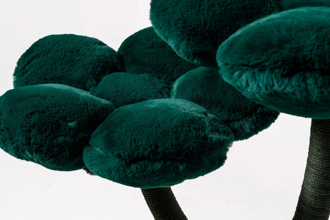 Large cats lounging on the stylish modern cat bed atop the tree
