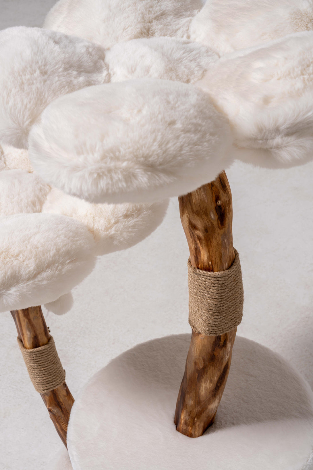 Plush bedding on the modern cat tree for large cats
