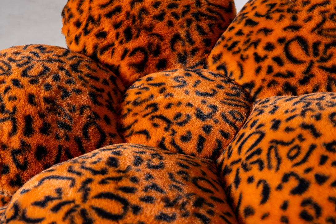 Relaxed cats resting comfortably in the inviting cat bed cave of the Luxe Leopard Blossom Cat Tree